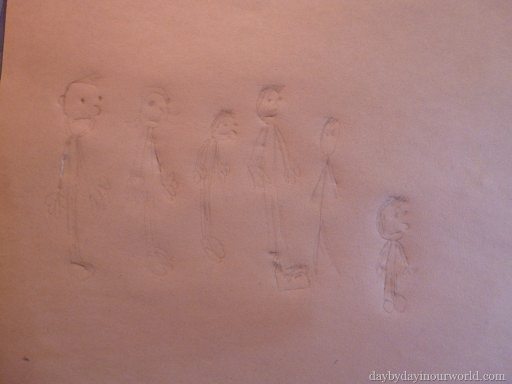 Paper with drawing of a family.