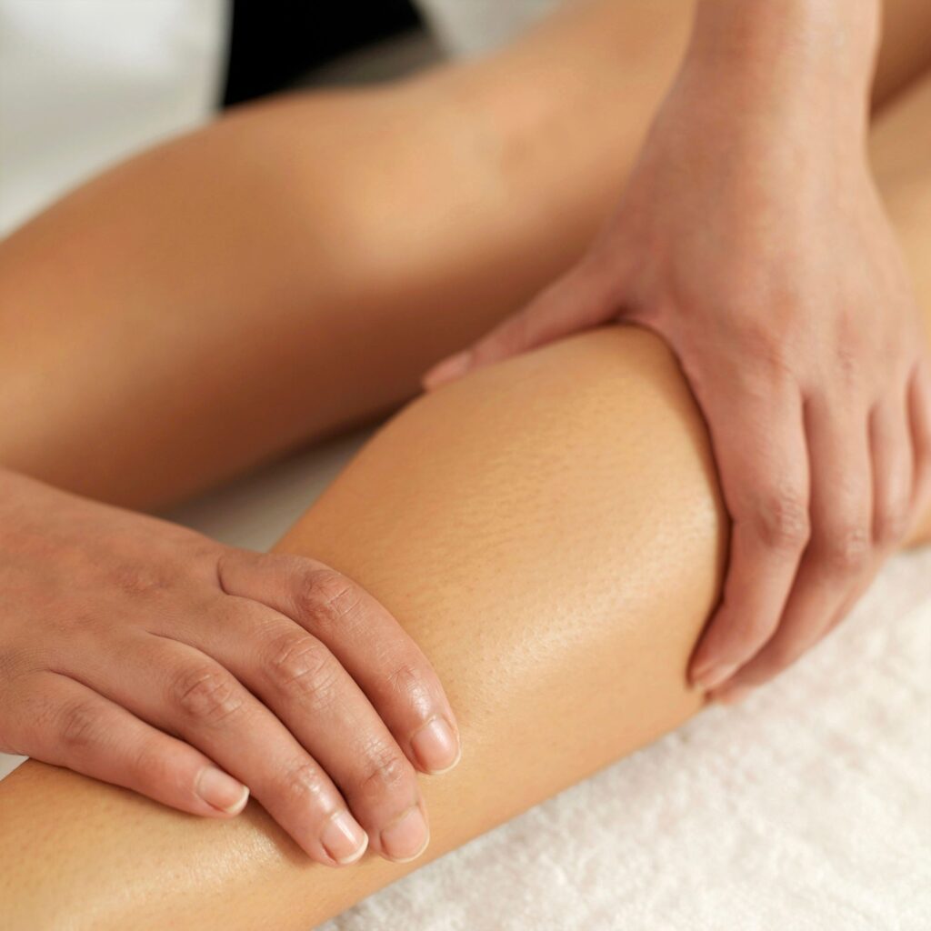 leg is massaged with 2 hands