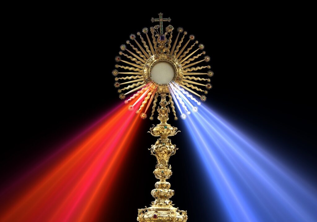 Monstrace with Blessed Sacrament; red and blue light shines from Eucharist.