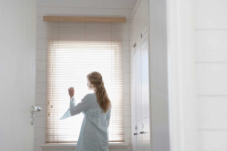 Woman Looking Out Window