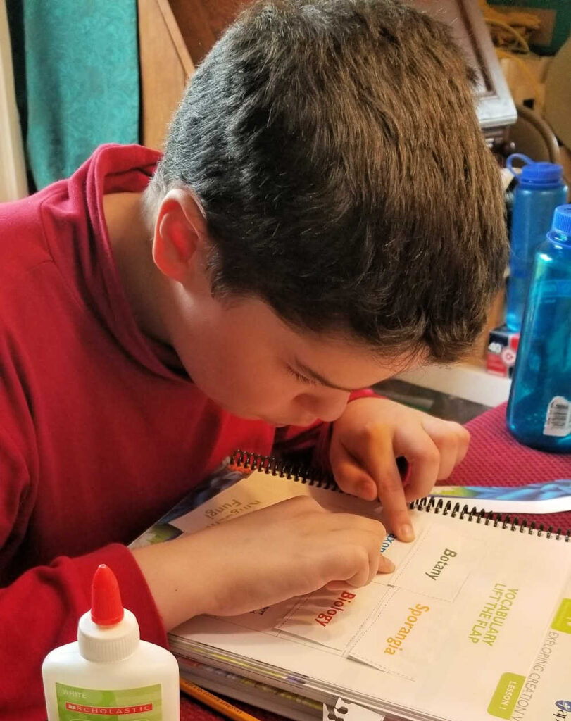 Working on an activity page in the Notebooking Journal