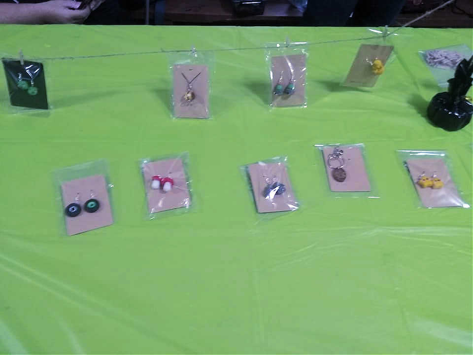 Creativity displayed in custom jewelry, both necklaces and earrings.
