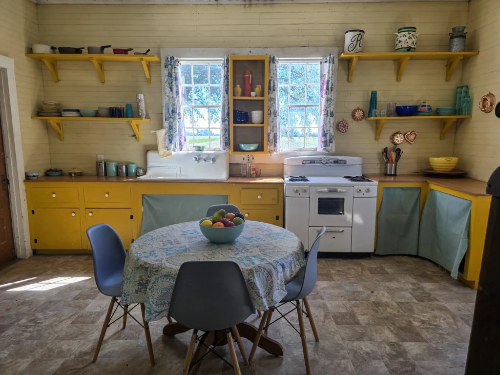 Colorful yellow kitchen in a building behind St. Joseph Plantation used as a filming location for Queen Sugar.