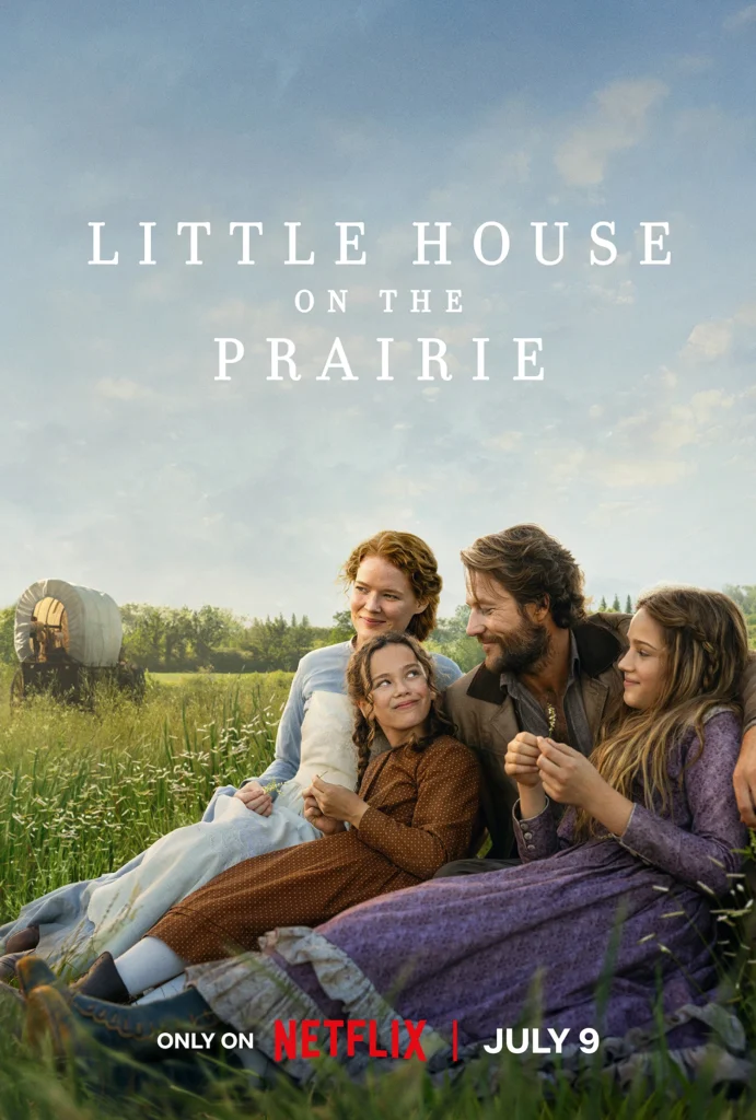 Promotional poster for Netflix’s Little House on the Prairie featuring a pioneer family sitting together in a grassy field with a covered wagon in the background.